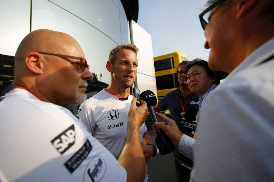 Jenson Button faces the press