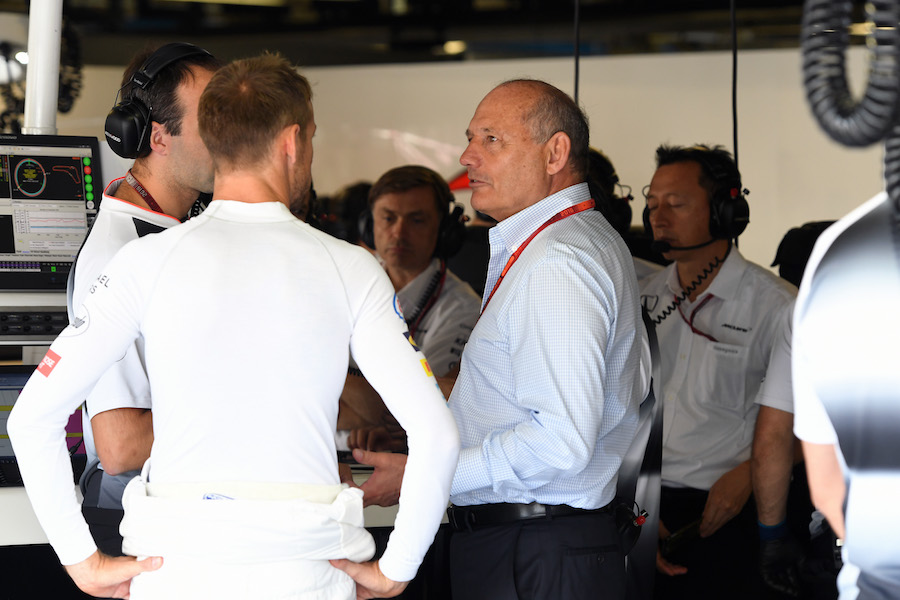Jenson Button and Ron Dennis talks in the garage