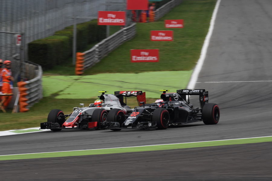 Jenson Button and Esteban Gutierrez battle for a position