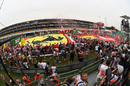 Fans and giant Ferrari flag on the track after the race