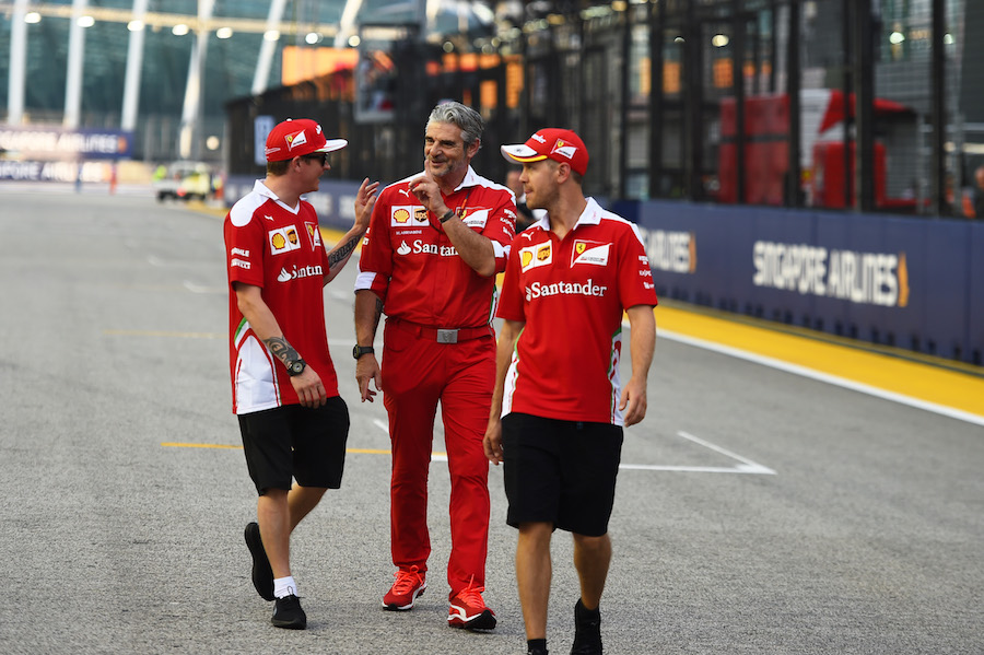 Sebastian Vettel, Kimi Raikkonen and Maurizio Arrivabene walk the track