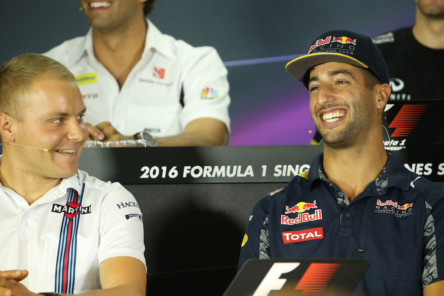 Daniel Ricciardo and Valtteri Bottas smile during the press conference