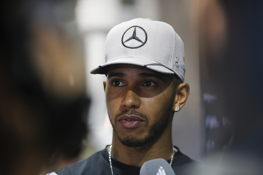 Lewis Hamilton speaks with media