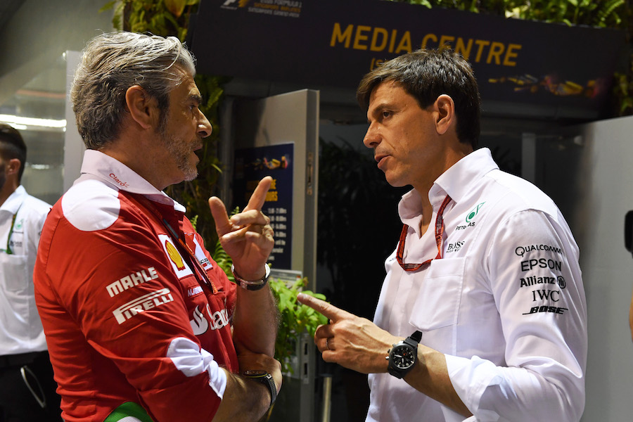 Maurizio Arrivabene and Toto Wolff talk at the paddock