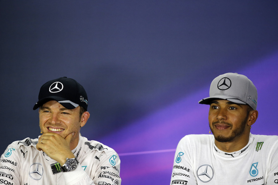 Nico Rosberg and Lewis Hamilton smile in the press conference after qualifying