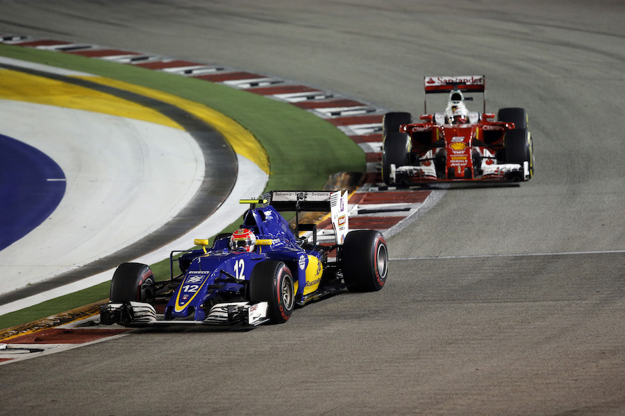 Sebastian Vettel and Felipe Nasr battle for a position