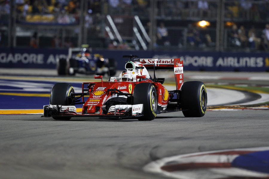 Sebastian Vettel works hard to keep its pace