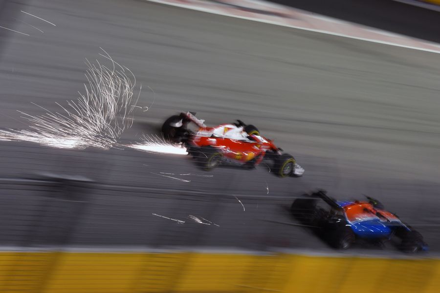 Sebastian Vettel at speed to pass Pascal Wehrlein