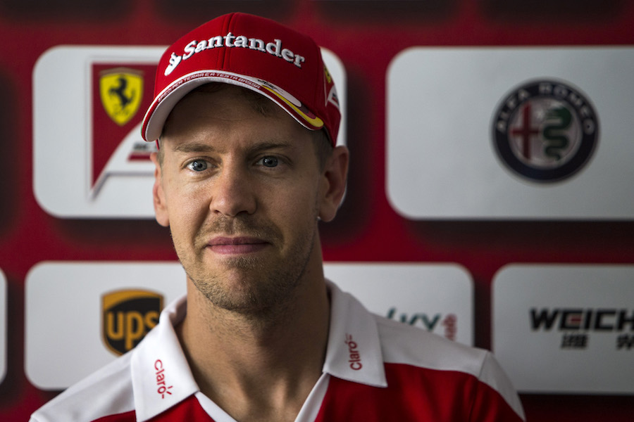 Sebastian Vettel talks to media