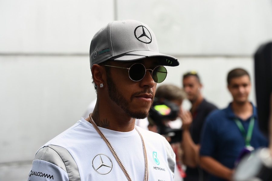 Lewis Hamilton talks to the media