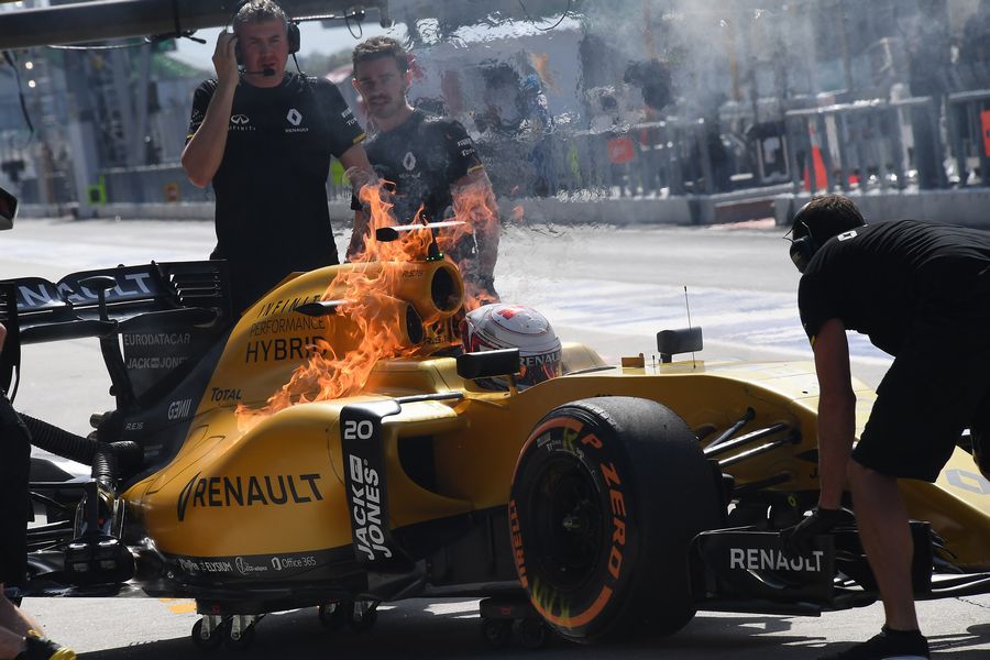 Kevin Magnussen in the Renault with fire in FP1