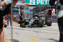 Sergio Perez returns to the pitbox