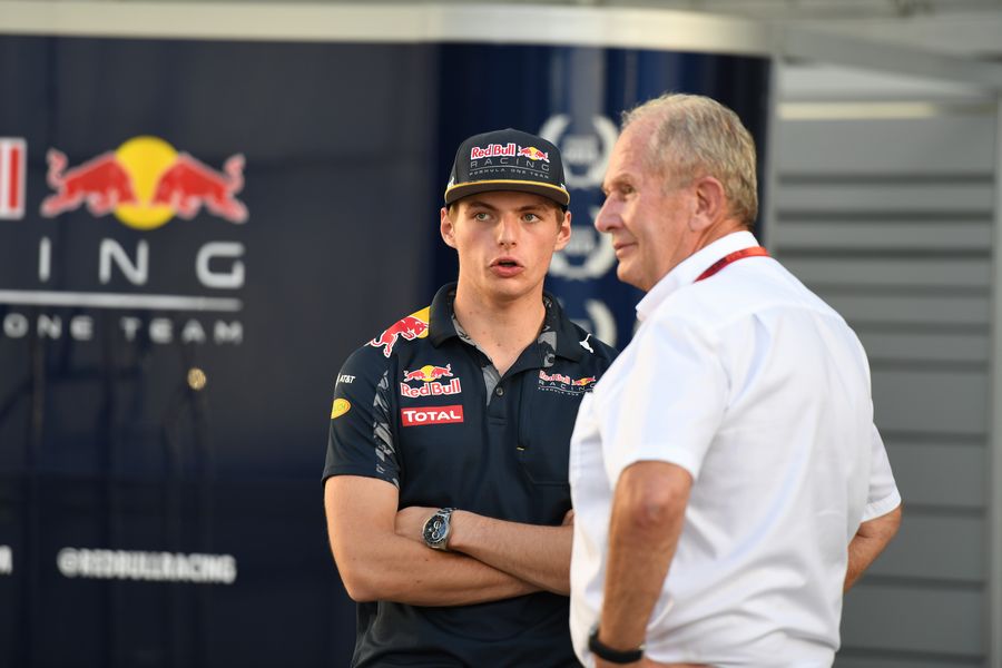 Max Verstappen speaks with Helmut Marko at the paddock