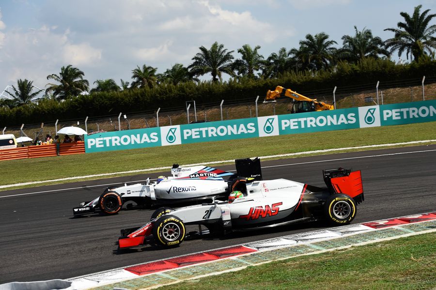Esteban Gutierrez battles for a position with Felipe Massa