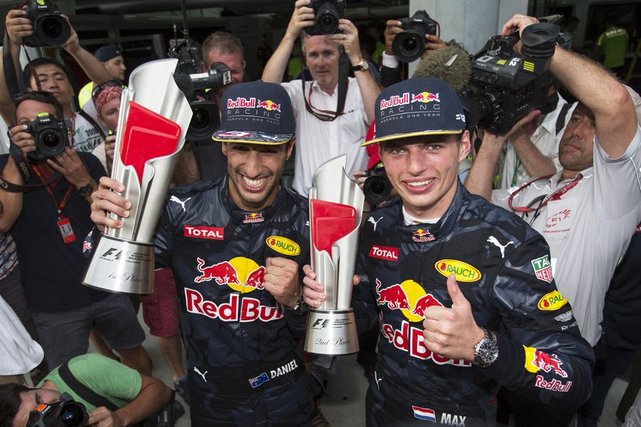 Daniel Ricciardo and Max Verstappen celebrate with the trophies