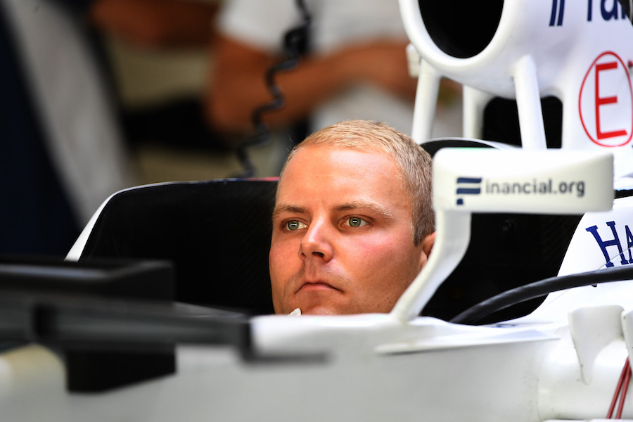 Valtteri Bottas sits in the cockpit