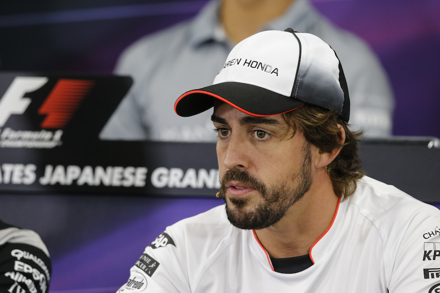 Fernando Alonso looks on during the press conference