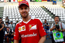 Sebastian Vettel smiles for the photographers
