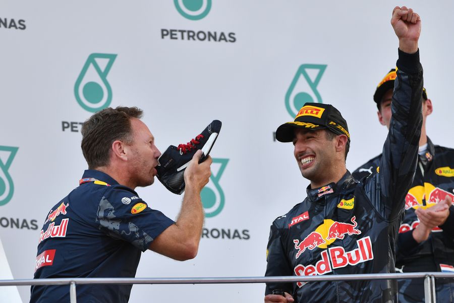 Christian Horner celebrate on the podium with shoey