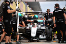 Lewis Hamilton returns to the pitbox