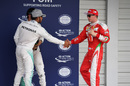 Lewis Hamilton and Kimi Raikkonen shake hands in parc ferme