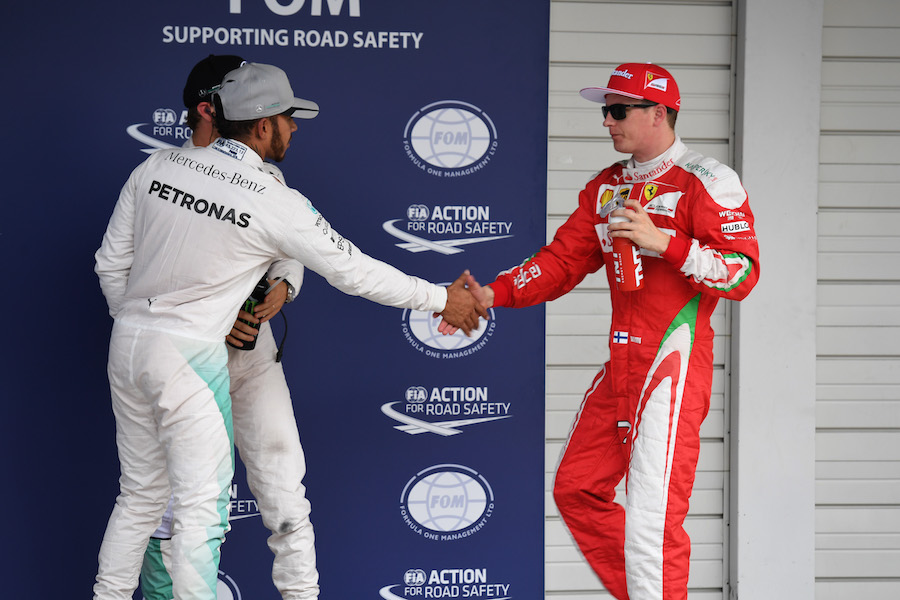 Lewis Hamilton and Kimi Raikkonen shake hands in parc ferme