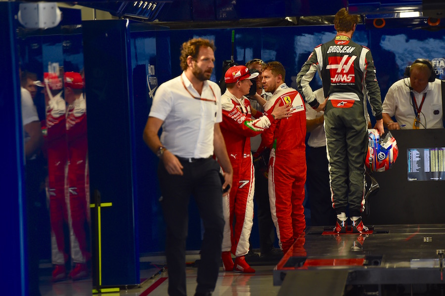 Kimi Raikkonen and Sebastian Vettel chat after qualifying