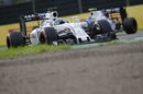 Felipe Massa works hard to defend his position from his teammate