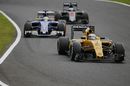 Kevin Magnussen leads Marcus Ericsson and Fernando Alonso