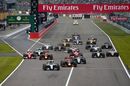 Nico Rosberg leads while Lewis Hamilton downs the field at the race start