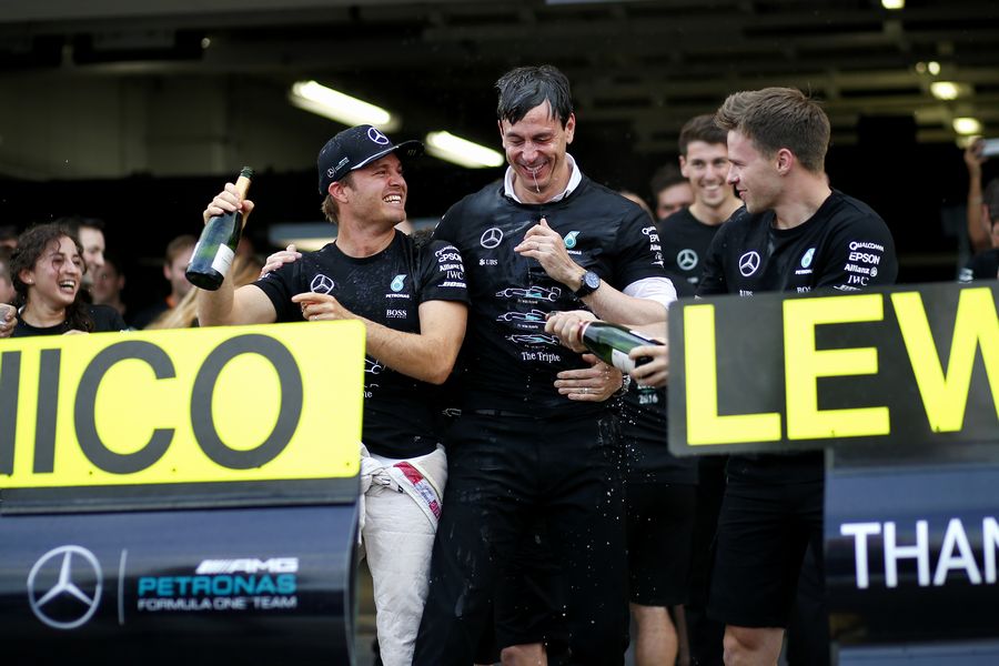 Nico Rosberg and Toto Wolff celebrate the constructors championship with champagne