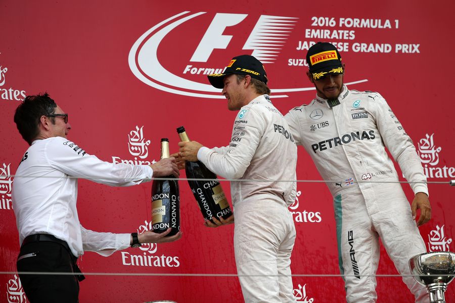 Mercedes celebrates on the podium with the champagne
