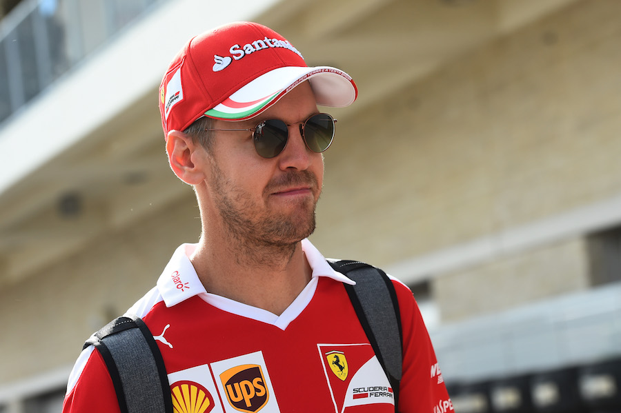Sebastian Vettel arrives the paddock on Thursday