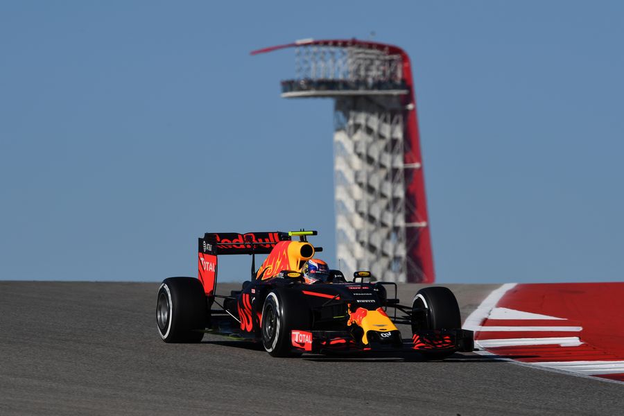 Max Verstappen on track with the COTA tower in the background
