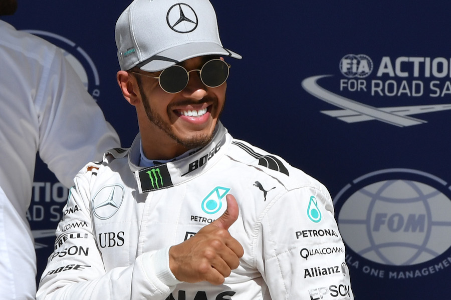 Lewis Hamilton smiles in parc ferme after qualifying