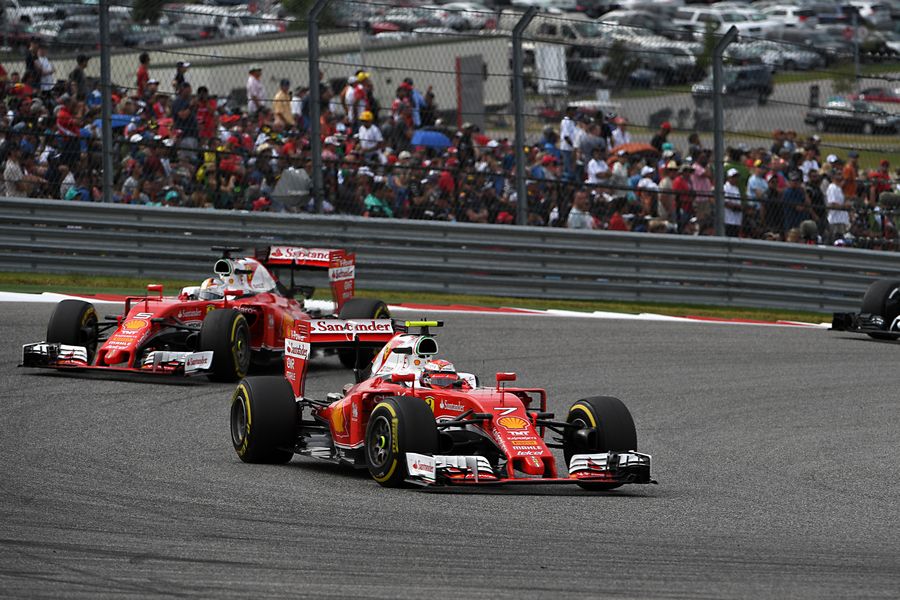 Kimi Raikkonen leads Sebastian Vettel at the early stage of the race
