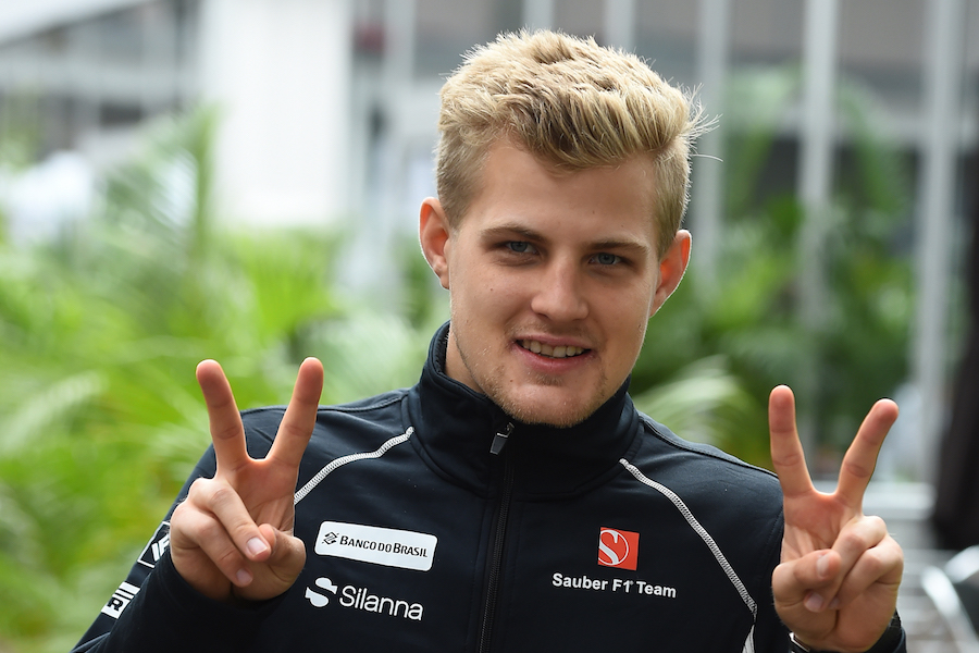 Marcus Ericsson poses for a photograph at the paddock
