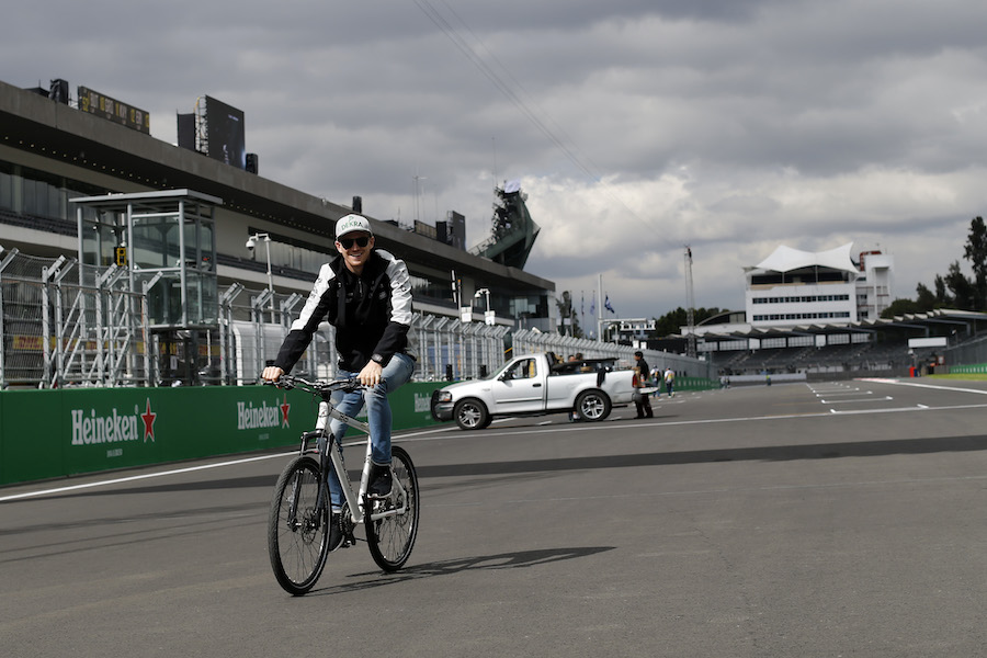 Nico Hulkenberg rides a bike