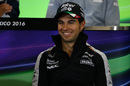 Sergio Perez smiles in the press conference
