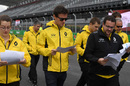 Jolyon Palmer walks the track with his engineers