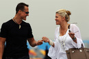 Michael Schumacher and his wife, Corinna, arrive in the paddock