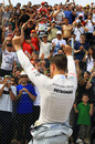 Michael Schumacher salutes the crowd after his exit