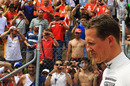 Michael Schumacher heads off after his exit