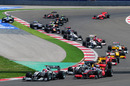Michael Schumacher overtakes Jenson Button at the start of the Turkish Grand Prix