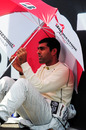 Karun Chandhok shelters from the sun before the race