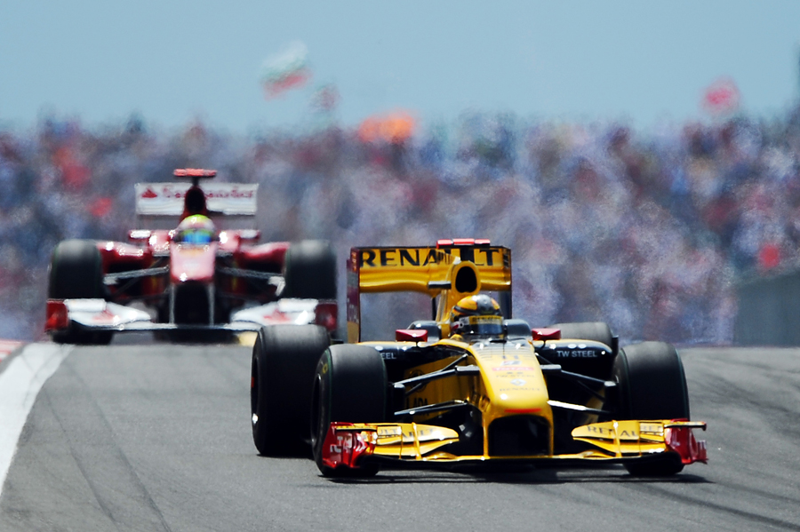 Vitaly Petrov leads Fernando Alonso shortly before the pair clashed