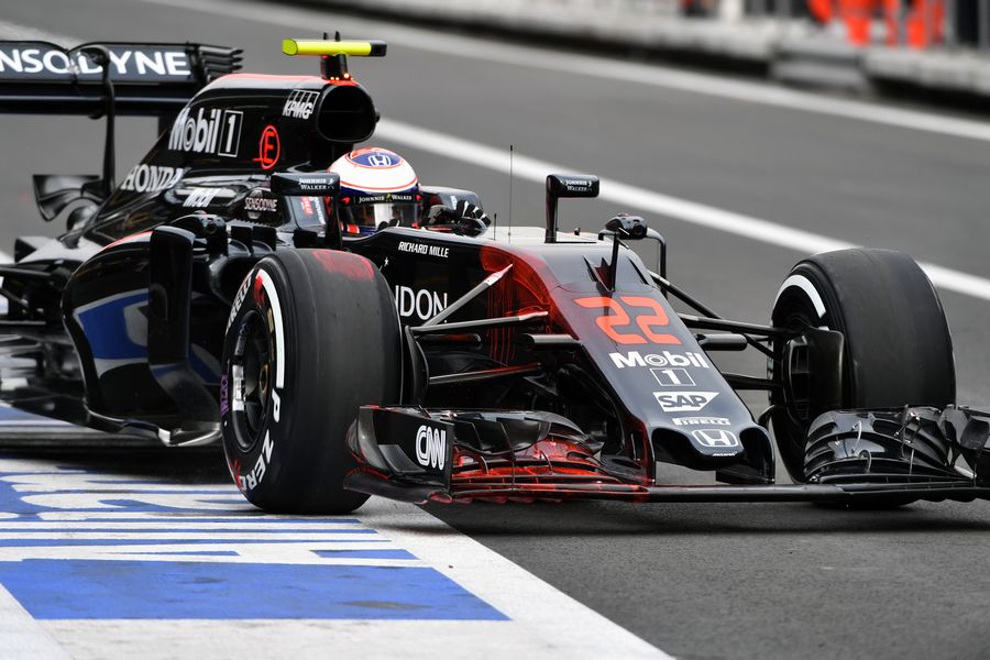 Jenson Button leaves the garage with aero paint on front wing and nose