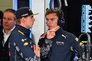 Max Verstappen chats with Pierre Gasly in the Red Bull garage