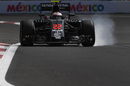 Jenson Button locks up heavily in the McLaren