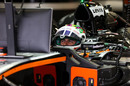 Sergio Perez looks on in the cockpit